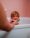 photo of boy in bathtub eating watermelon